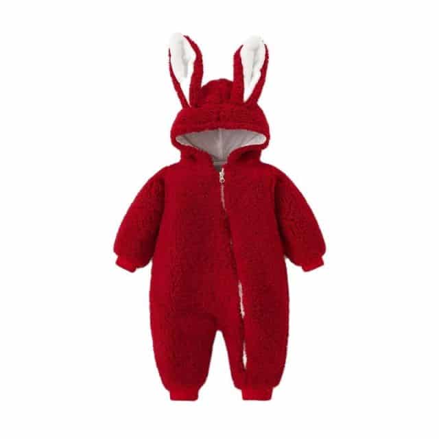 Girls' Soft Winter Snowsuit with Bunny Ears in pink shown in a child's bedroom – stylish and cosy choice for girls from Little Pirates.