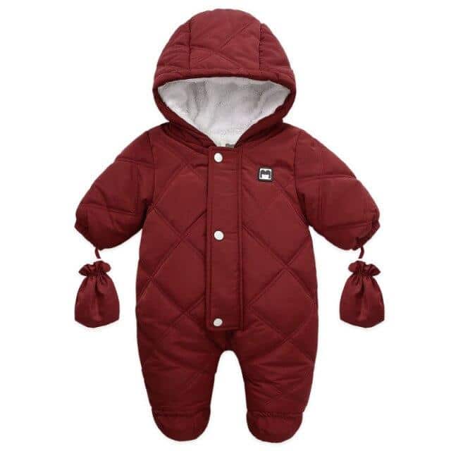 Detail of the integrated gloves and cuffs on the pink long-sleeve snowsuit for baby girls.