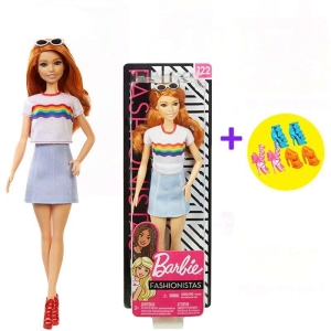 Close-up of the elegant white outfit on the fashion doll for girls in her gift box.