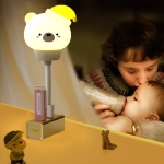 Bedside view of the bunny and bear USB LED night lights for girls in a cosy room.