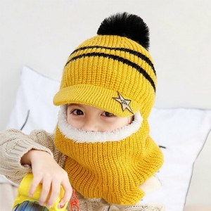 A cosy yellow winter balaclava hat with a fun pom-pom, keeping girls warm and stylish on cold days.