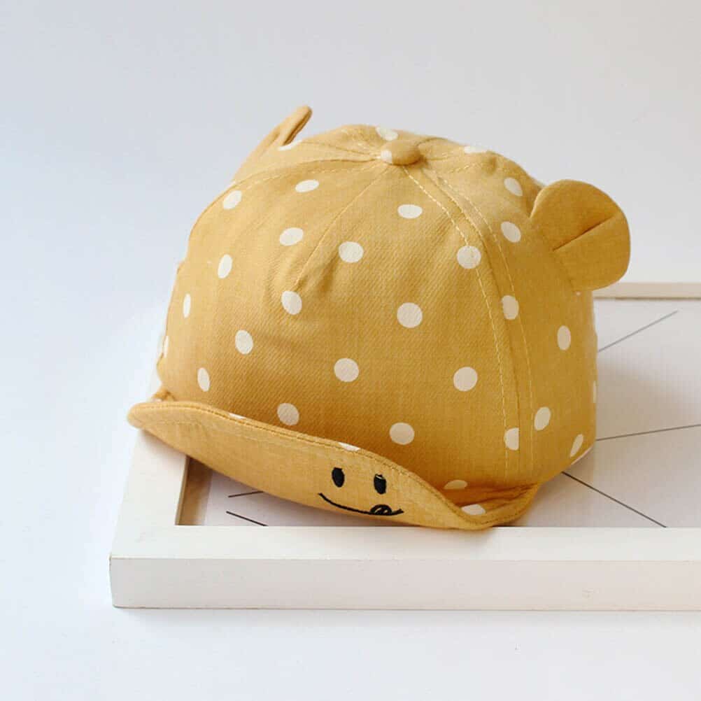Polka Dot Summer Cap for Baby shown in a child's bedroom – stylish and cosy choice for girls from Little Pirates.