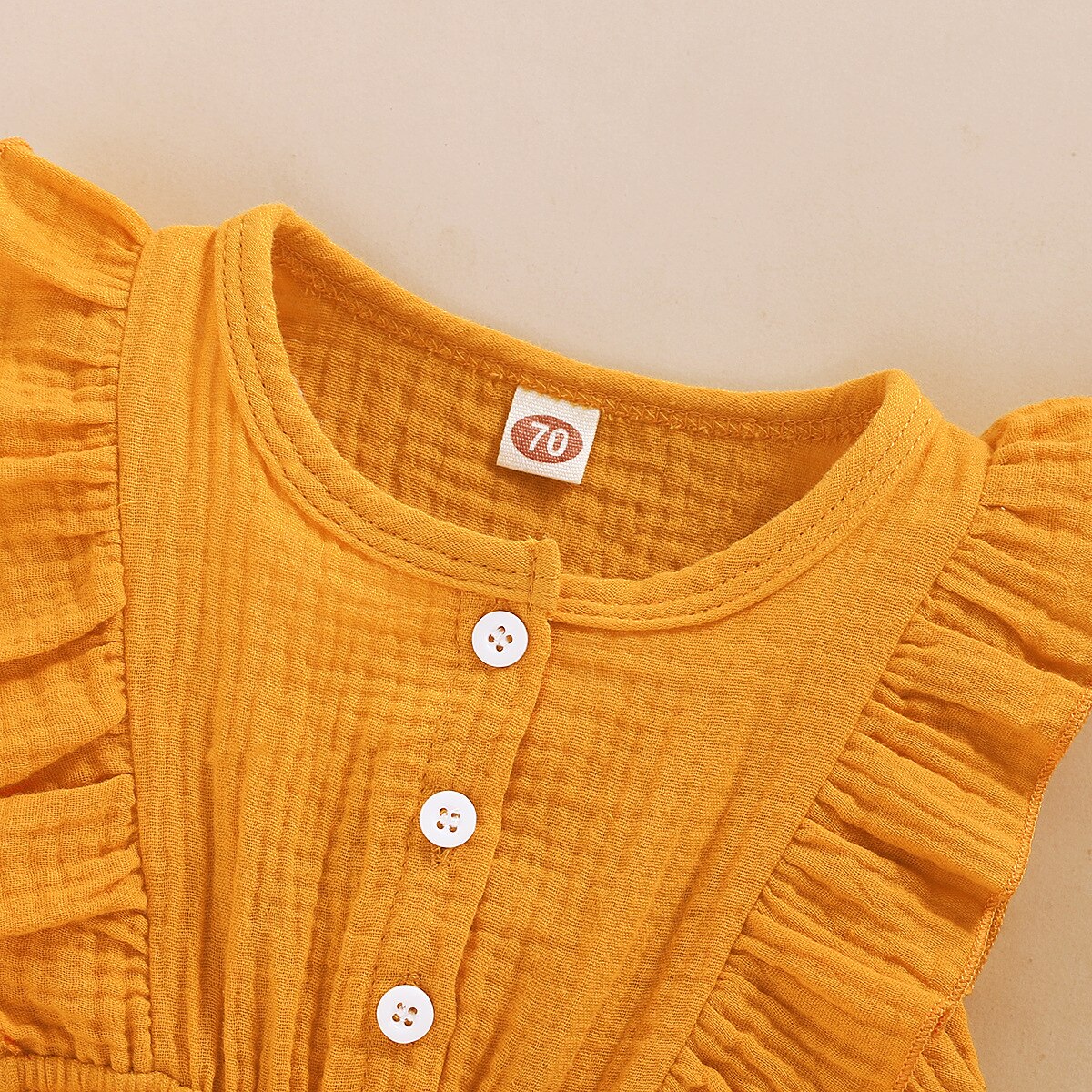 Detail view of the Girls' Playsuit with Matching Headband in white, showing all available colours and features – Little Pirates Ireland.