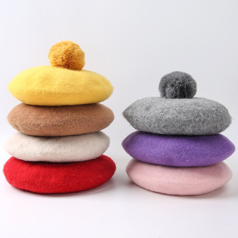 Detail view of the Girls' Pom Pom Beret, showing all available colours and features – Little Pirates Ireland.