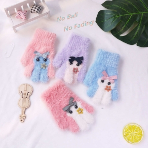 Girls' Winter Gloves for Ages 2 to 5 in green, on a table – a fun and playful gift for girls from Little Pirates.