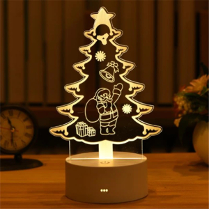 3D Christmas tree LED night light glowing with warm light in a girl's bedroom.