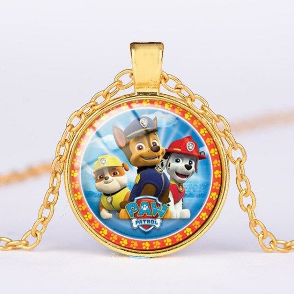 Close-up of the gold round Paw Patrol pendant showing three favourite characters in vibrant detail.