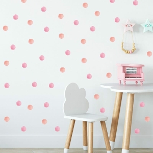 Fun and vibrant polka dot wall stickers in a range of colours, perfect for decorating a girl's bedroom wall.