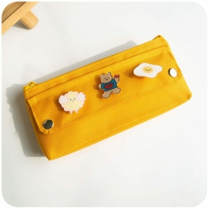 A yellow cartoon print pencil case for girls displayed on a flat surface, a trendy and fun school accessory.