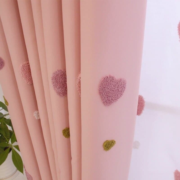 Close-up of the heart motif on this decorative curtain for girls bedrooms, showing the charming pattern detail.