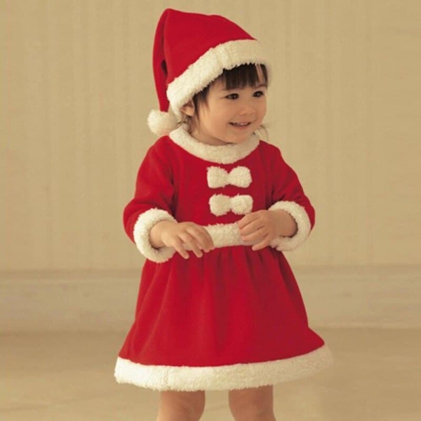 Detail of the Christmas costume dress for girls highlighting the white trim and cheerful festive styling.