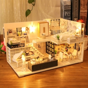 Detail shot of the small dolls house for girls highlighting the accessories and fun decorative features.