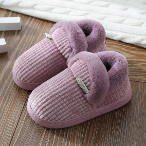 Side view of the violet winter slippers for girls, highlighting the stylish shape and warm lining.