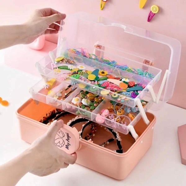 A clear jewellery box for girls displayed on a table, stylish and practical for storing precious accessories.