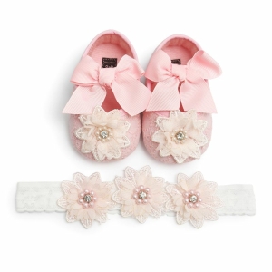 Adorable pink and white girls ballet flats with a bow and flower detail, stylish and sweet for little ones.