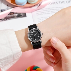 A girls' watch with a colourful nylon strap, adorable and stylish as a first watch for children