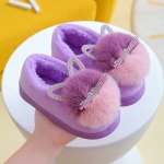 Girls cotton slippers with cat ears worn at home, showcasing the stylish design and comfortable fit.