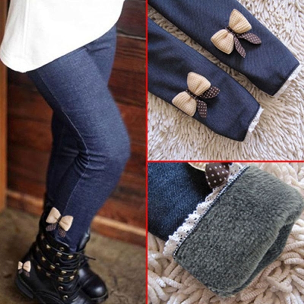 Girls' thick fleece-lined jeans with bow detail, warm and stylish for cold winter days at school