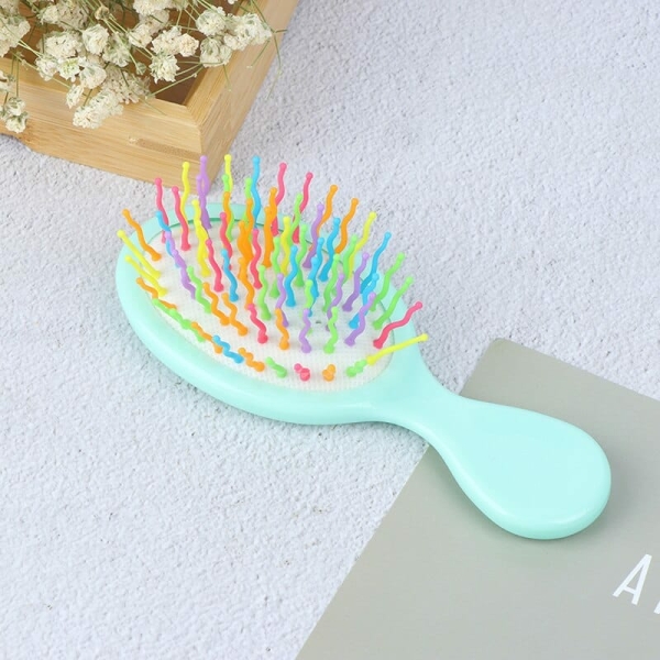 A delicate hair comb for girls, displayed on a table with a charming floral decoration.