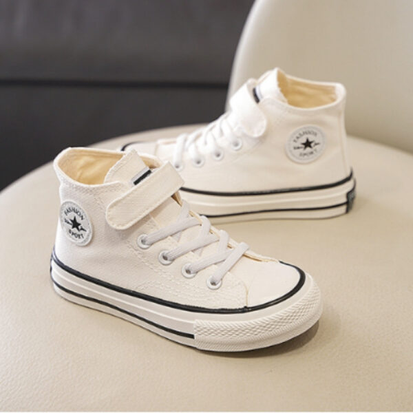 Close-up of the star detail on girls' Converse-style high-top trainers, a timeless and stylish look
