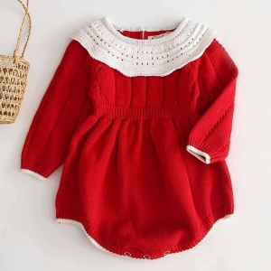 Charming red and white knitted romper for baby girls, combining festive style with warmth for a picture-perfect seasonal look.