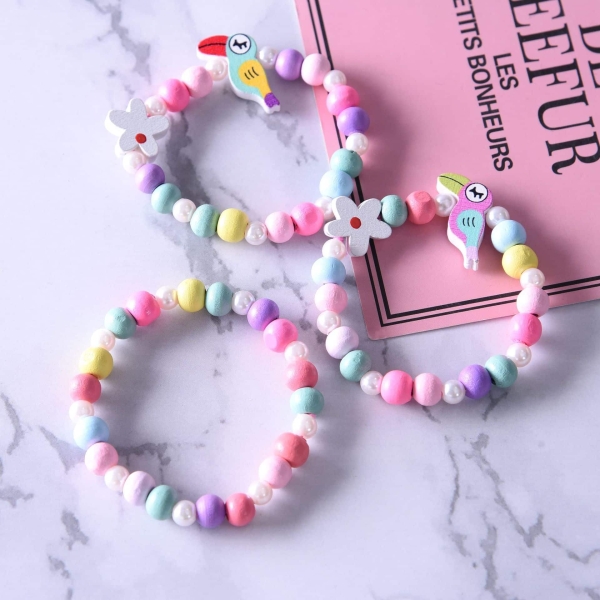 A set of three girls bracelets with sweet candy colour patterns displayed together on a table, perfect for playful accessorising.