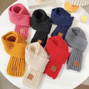 Close-up of the thermal knitted scarf texture showing the dense, warm weave and the rich plain colour finish.