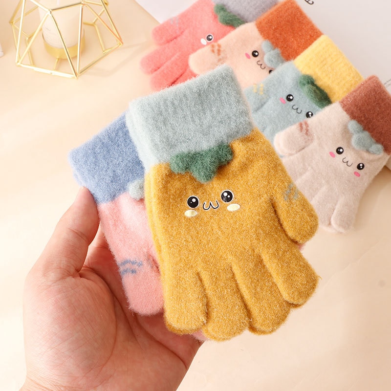 Close-up detail showing the soft cashmere fabric of girls winter gloves, perfect for keeping little hands cosy and stylish.