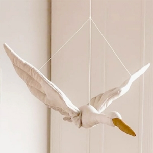 A beautifully crafted hanging swan plush toy for a baby nursery, soft and cuddly with graceful design, perfect for cot decoration or as a soothing companion.