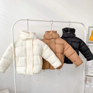 A smart girls quilted hooded puffer jacket, warm and well-styled with a neat quilted pattern, perfect for cold school days and weekend outings.