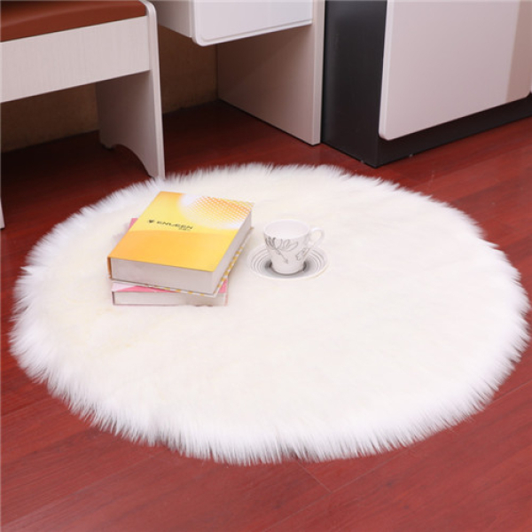 A luxuriously soft round white faux fur long pile girls bedroom rug, incredibly plush and cosy, adding a dreamy touch to any girl's room.