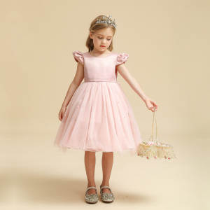 A dreamy girls pink tulle princess dress, with a full fluffy skirt and beautiful pink fabric, perfect for parties, dressing up, and feeling like a princess.
