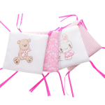 The Pink Bear Print Cot Bumper for Baby Girls shown in a styled nursery setting, adding colour and comfort for baby girls.