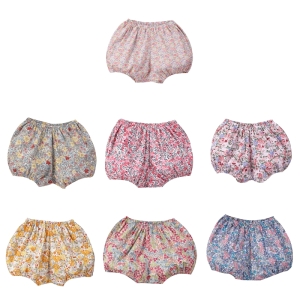 A sweet floral print bloomer for baby girls displayed on a white background, delicate and charming with pretty flower patterns.