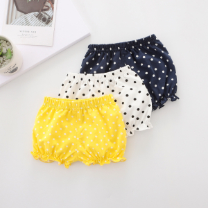 An adorable puffed bloomer for baby girls displayed on a white background, soft fabric with a voluminous gathered style.