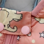 Full view of the pink elephant print baby girls lightweight puffer jacket showing the hood and zip closure.