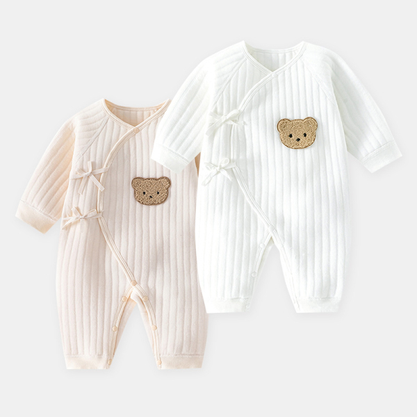 Two white and pink long-sleeve baby pyjamas with a sweet teddy bear detail on the front