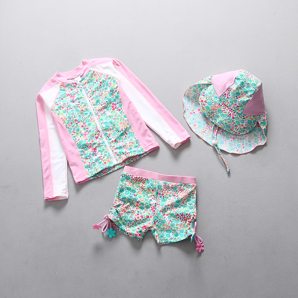 Girls' 3-Piece Sun Protection Swimwear Set photographed flat on white background, fun and colourful for summer holidays.