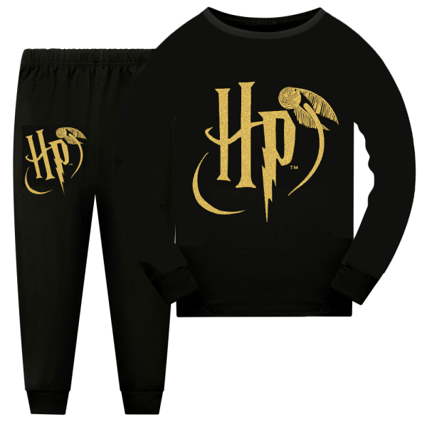 Detail view of the Harry Potter graphic on the long-sleeve top and matching trousers of the girls pyjama set.