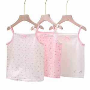 Three pink and white printed thin strap lace vests for girls hanging on clothes hangers, delicate and pretty.