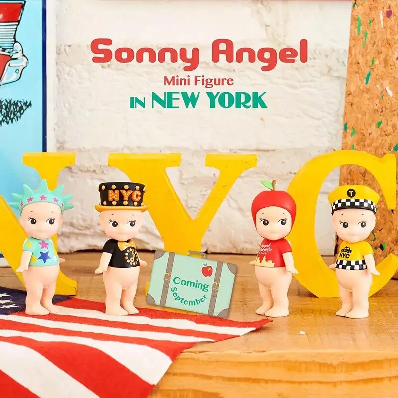 Four different Sonny Angel figurines on a New York theme display, set against a matching backdrop, a delightful collectable surprise gift for girls.