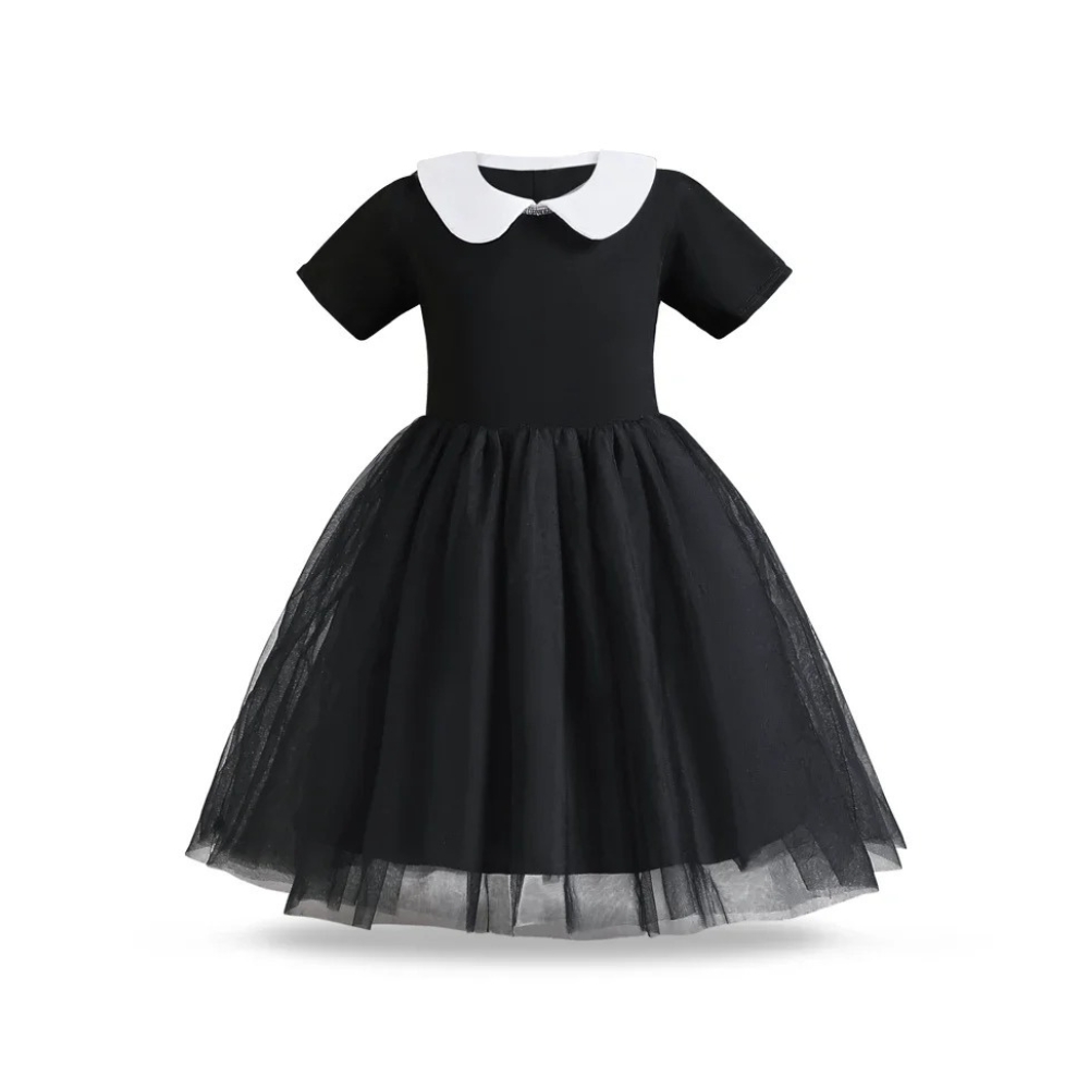A girl wearing a Wednesday Addams Halloween fancy dress, featuring an elegant black dress with a contrasting white collar, perfect for Halloween or costume parties.