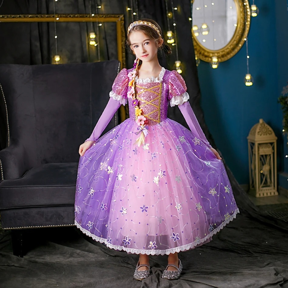 Close-up of the sparkling purple Rapunzel dress with intricate floral pattern details and shimmering fabric, a beautiful costume for aspiring princesses.