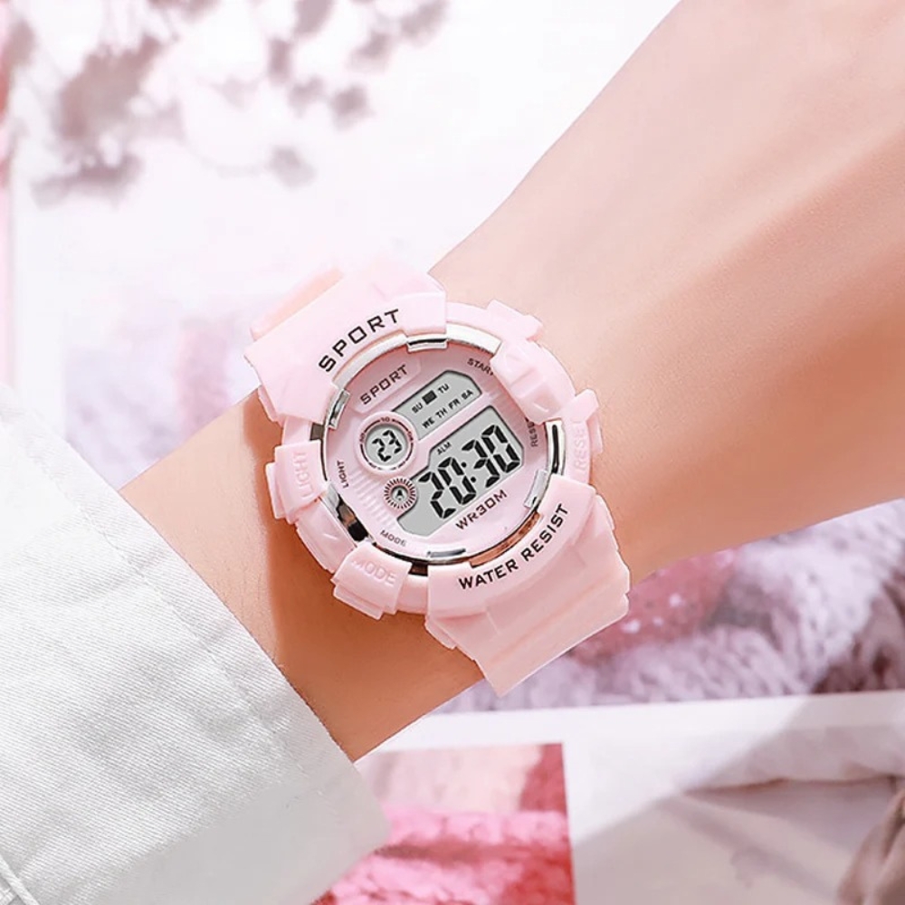 Pink multifunction waterproof sports watch for girls with a digital display showing time, date, and seconds, featuring a modern, robust design perfect for sports and everyday adventures.