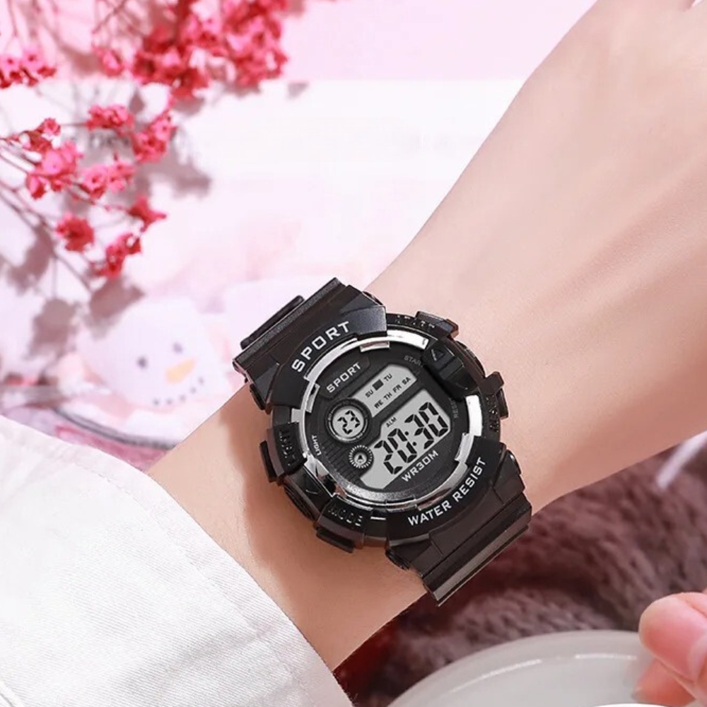 Close-up of the digital display on the waterproof sports watch for girls showing time, date, and seconds, a reliable and stylish companion for active young adventurers.