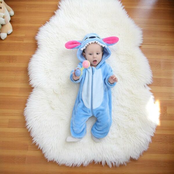 Full-length view of the Stitch soft fleece baby fancy dress costume laid flat, showing the complete character design and zip closure.