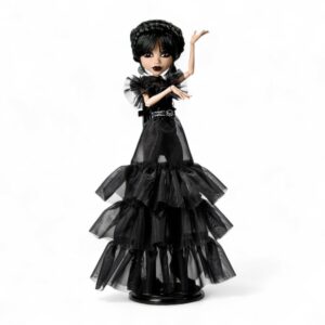 Wednesday Addams doll dressed in a dramatic black ball gown, posed on a white background.