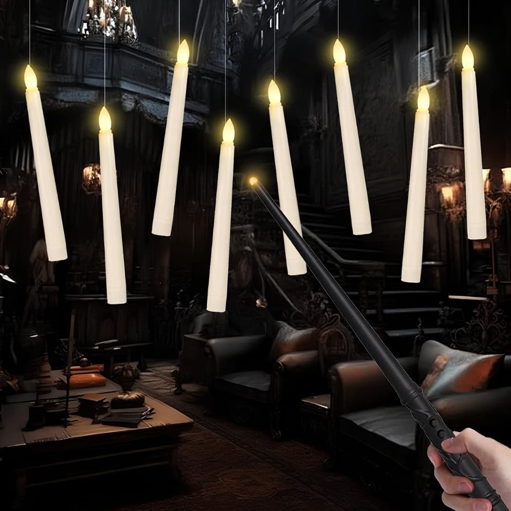Harry Potter floating LED candles with a magic wand, suspended in a dark atmospheric setting with lanterns and cosy armchairs.