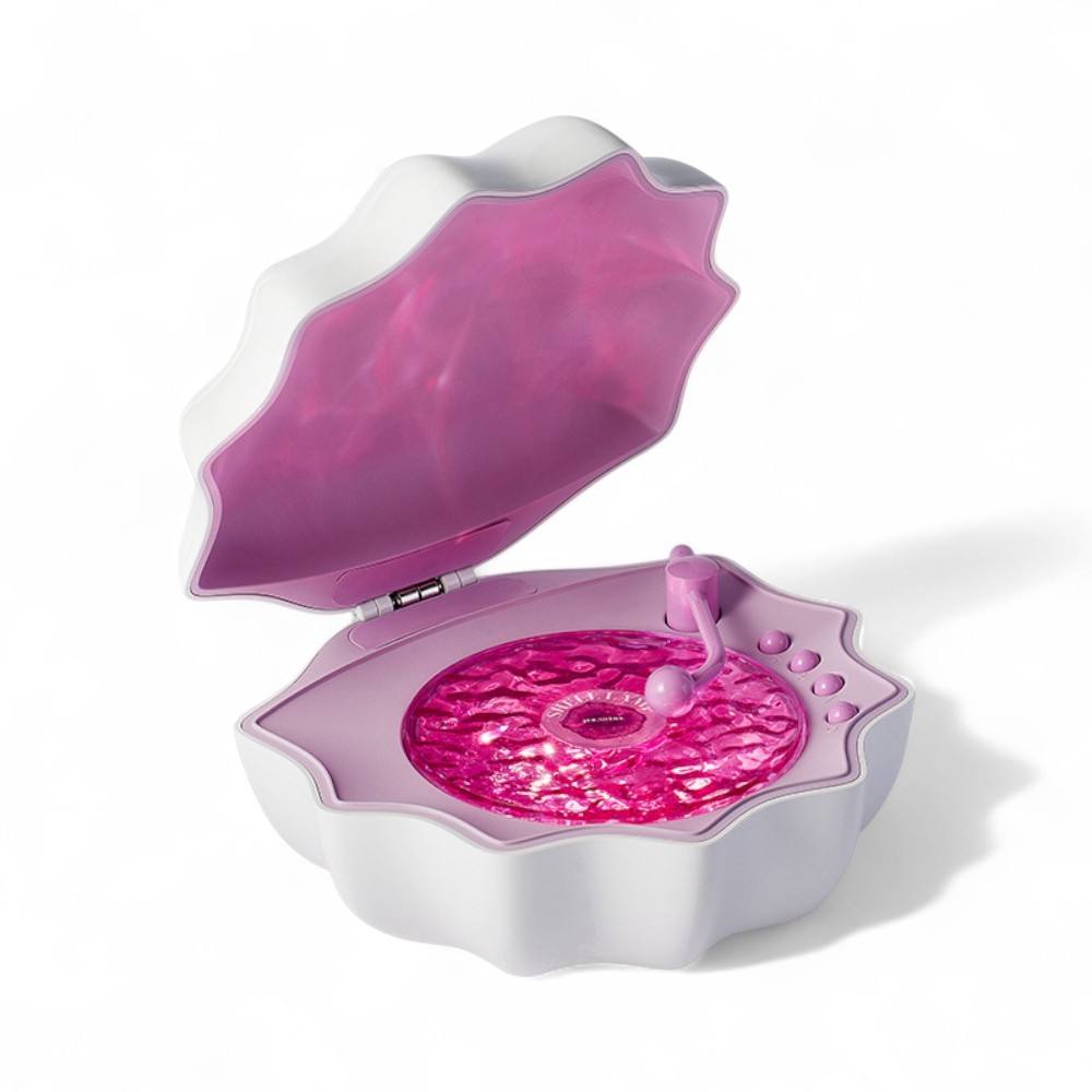 White shell-shaped Bluetooth night light with a rose-pink interior that projects beautiful ocean-inspired reflections onto walls.