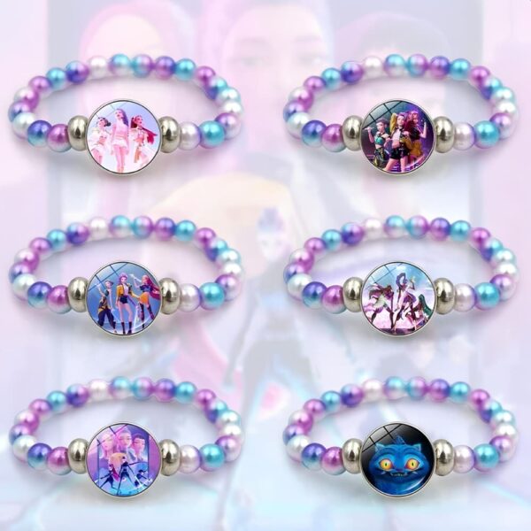Set of six K-pop Demon Hunters bracelets with pastel pink, purple, and white pearlescent beads and character medallion centrepieces on a soft pastel background.